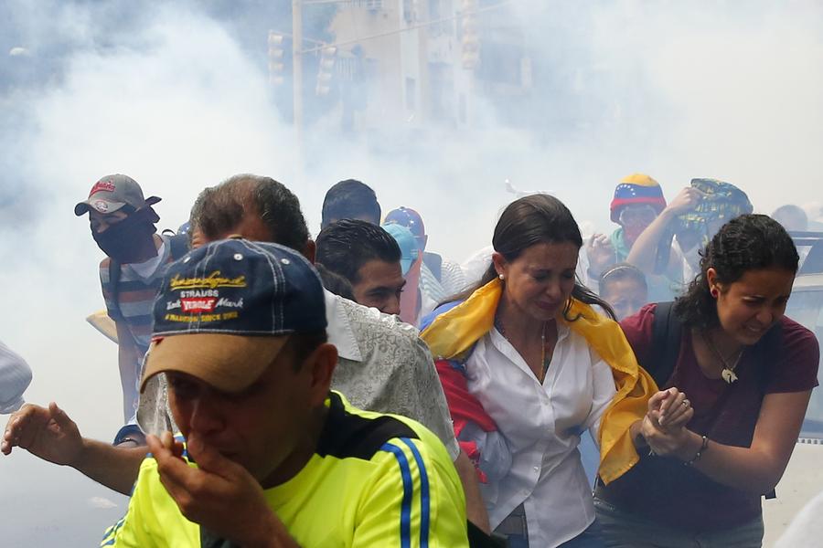 Venezuelan anti-govt protestors set on fire in rally