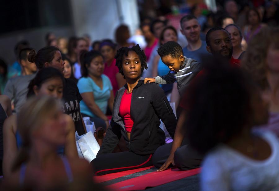 Thousands celebrate Summer Solstice with yoga in NY