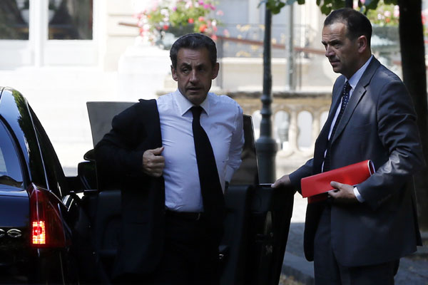 Sarkozy held for questioning