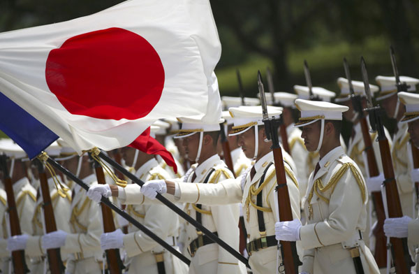 Japan approves defense white paper for 2014