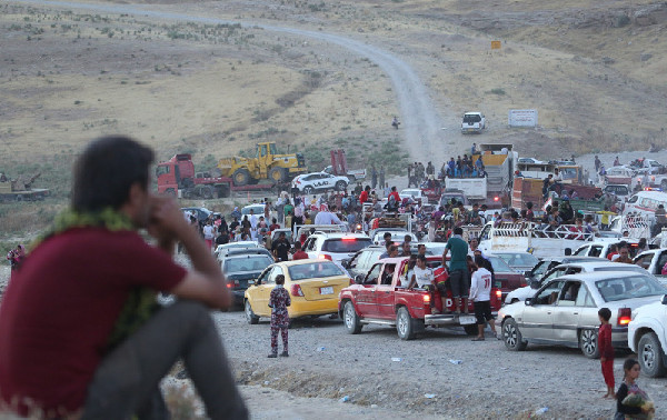 Iraq gov't backs Kurds, as Kurdish forces retake town from insurgents