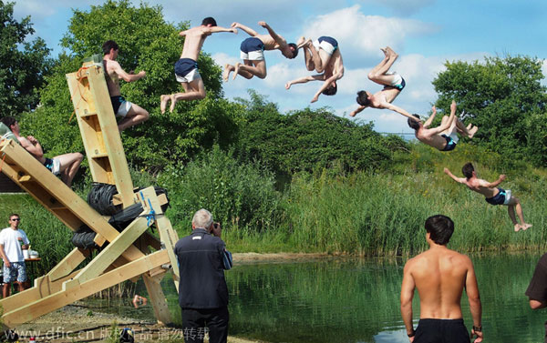 Catapulting into air to dive in lake
