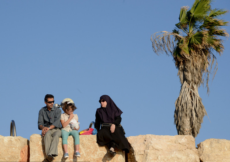 Palestinian Muslims enjoy Mediterranean Sea
