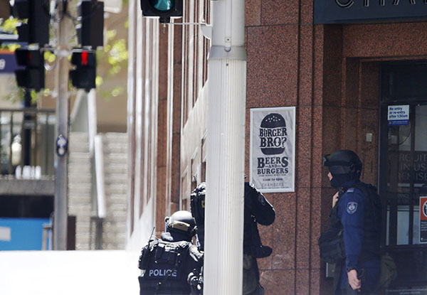 Hostages held in Sydney cafe, Islamic flag seen in window