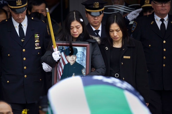 Thousands gather in NYC for funeral for slain police officer