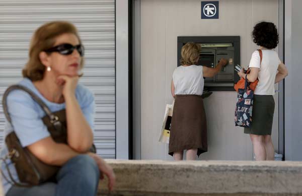 Greek faces tough conditions under deal with euro zone