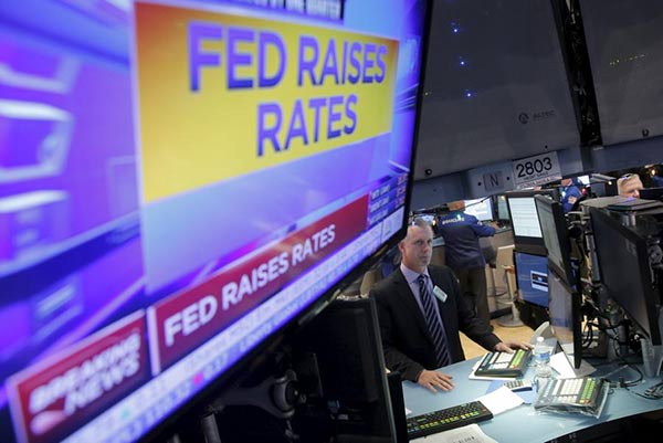 Fed raises interest rates, first rate hike since 2006