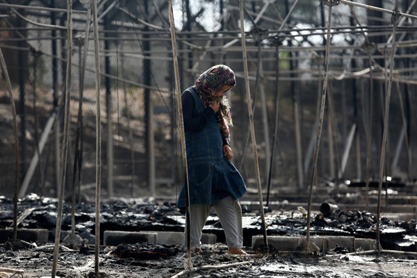Greek govt vows to improve refugee situation on island after fire