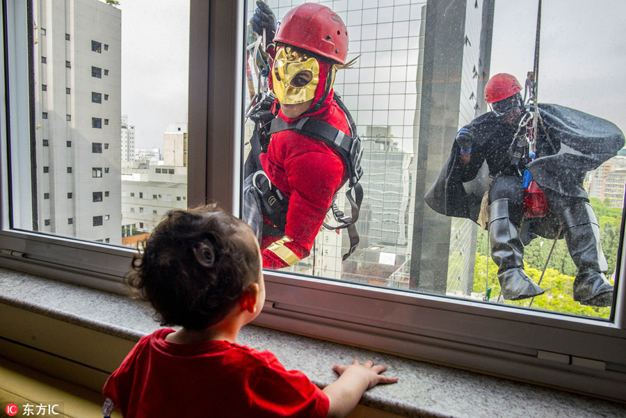Superheroes make surprise visit to Brazil's children's hospital