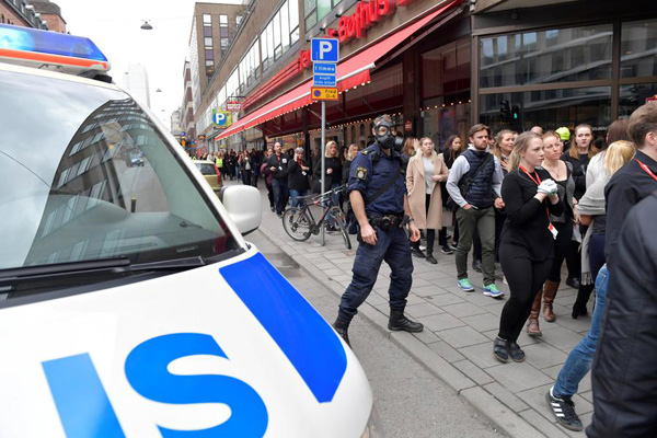Pedesitrians killed as truck drives into crowd outside Stockholm shop, shots fired