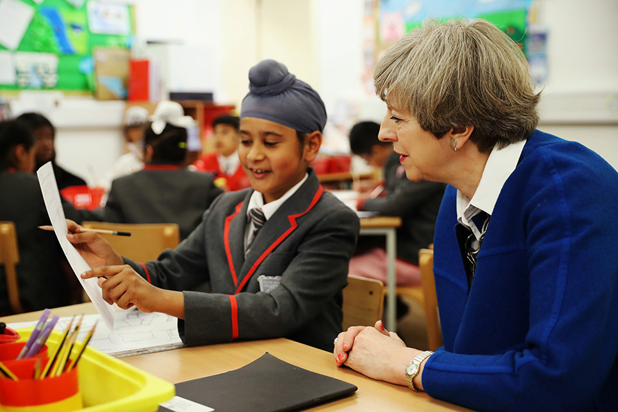 Britain's PM May meets pupils of primary school in Birmingham