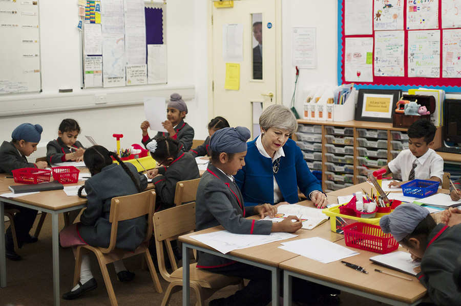 Britain's PM May meets pupils of primary school in Birmingham