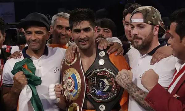 Indian boxer offers championship belt to Chinese rival as gesture of peace