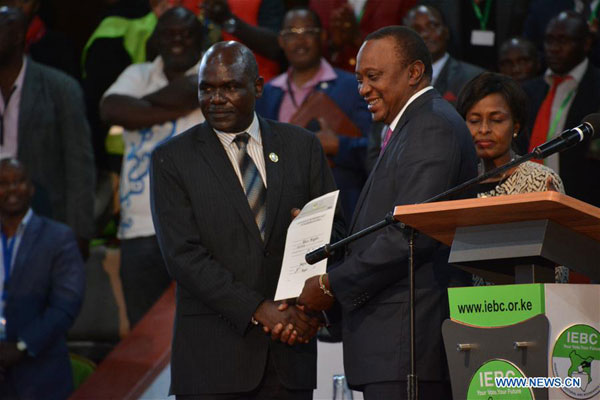 Kenya's Kenyatta wins re-election, pledges to unite nation