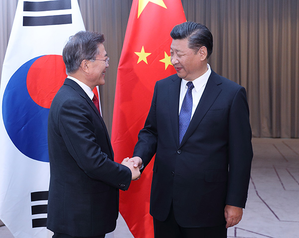 Xi pledges concerted efforts with Moon to properly address differences between China, South Korea